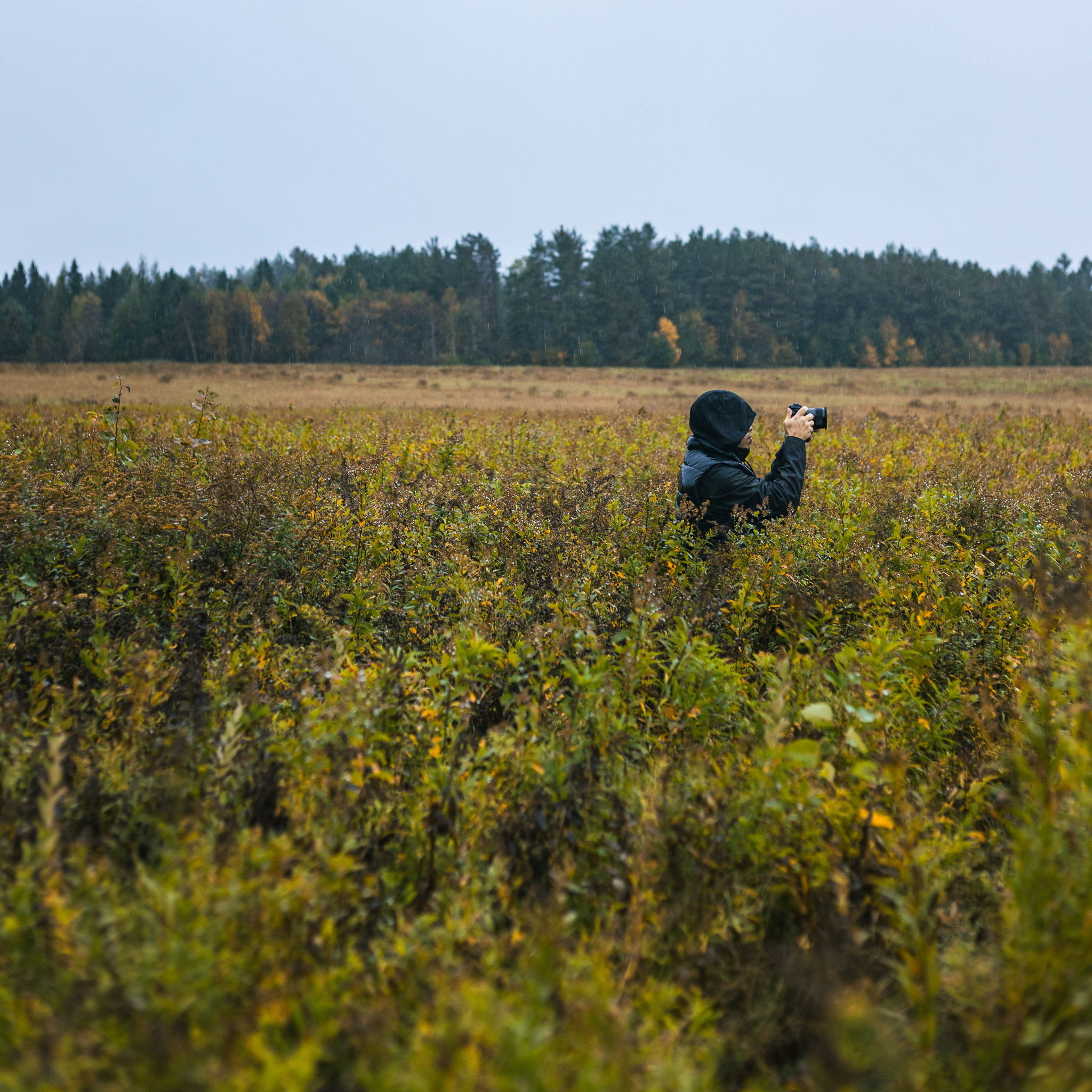 Chris Rivera shooting photos in the rain