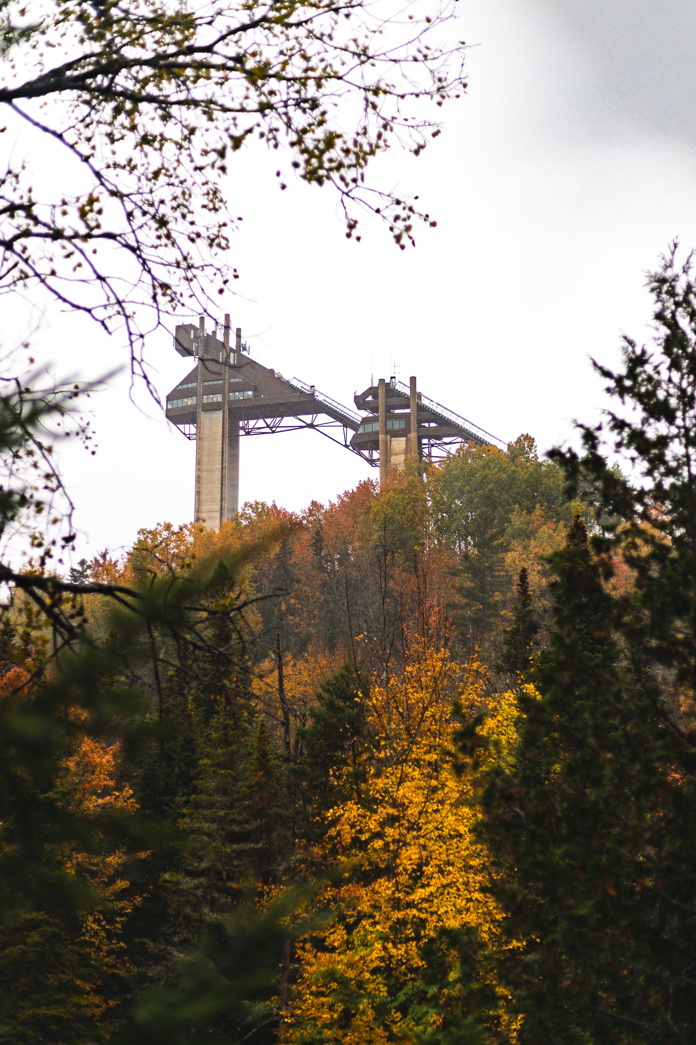 Olympic Jumping Complex behind fall foliage