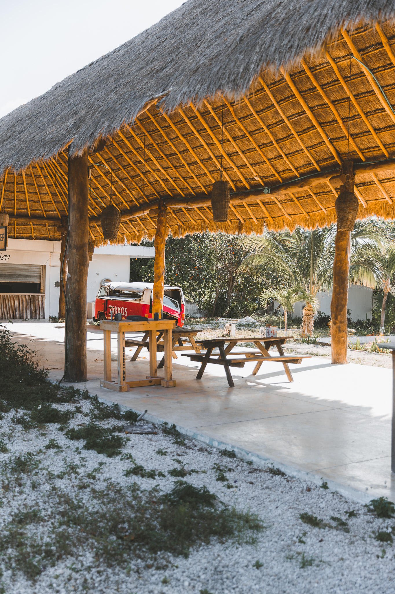 Pavilion with red van in the background