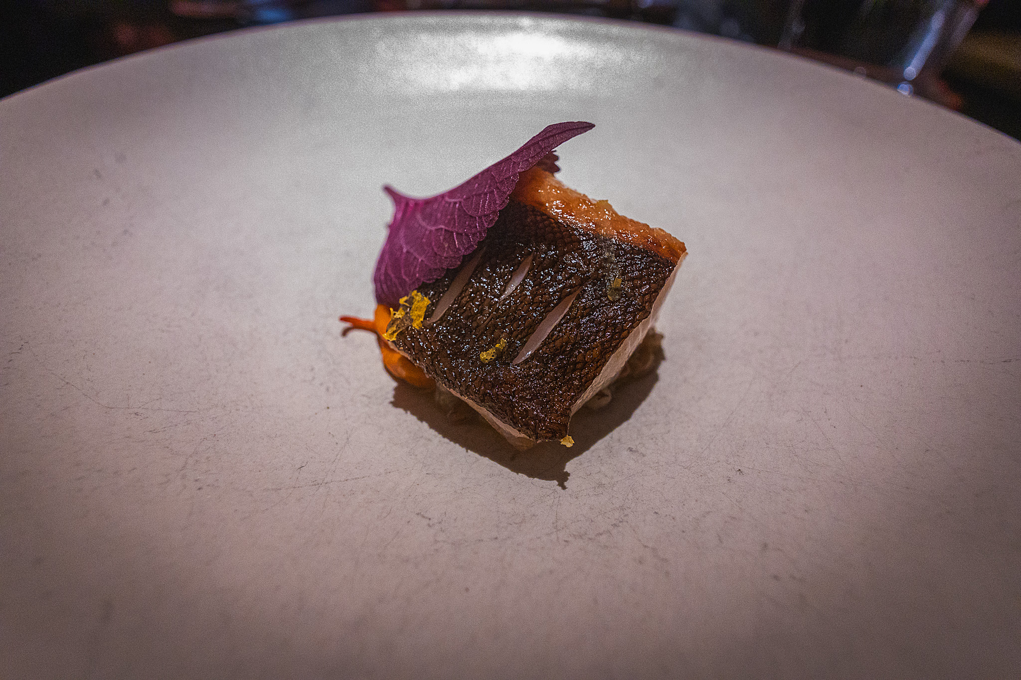 Black cod with grains, cordyceps, and kimchi beurre fondu