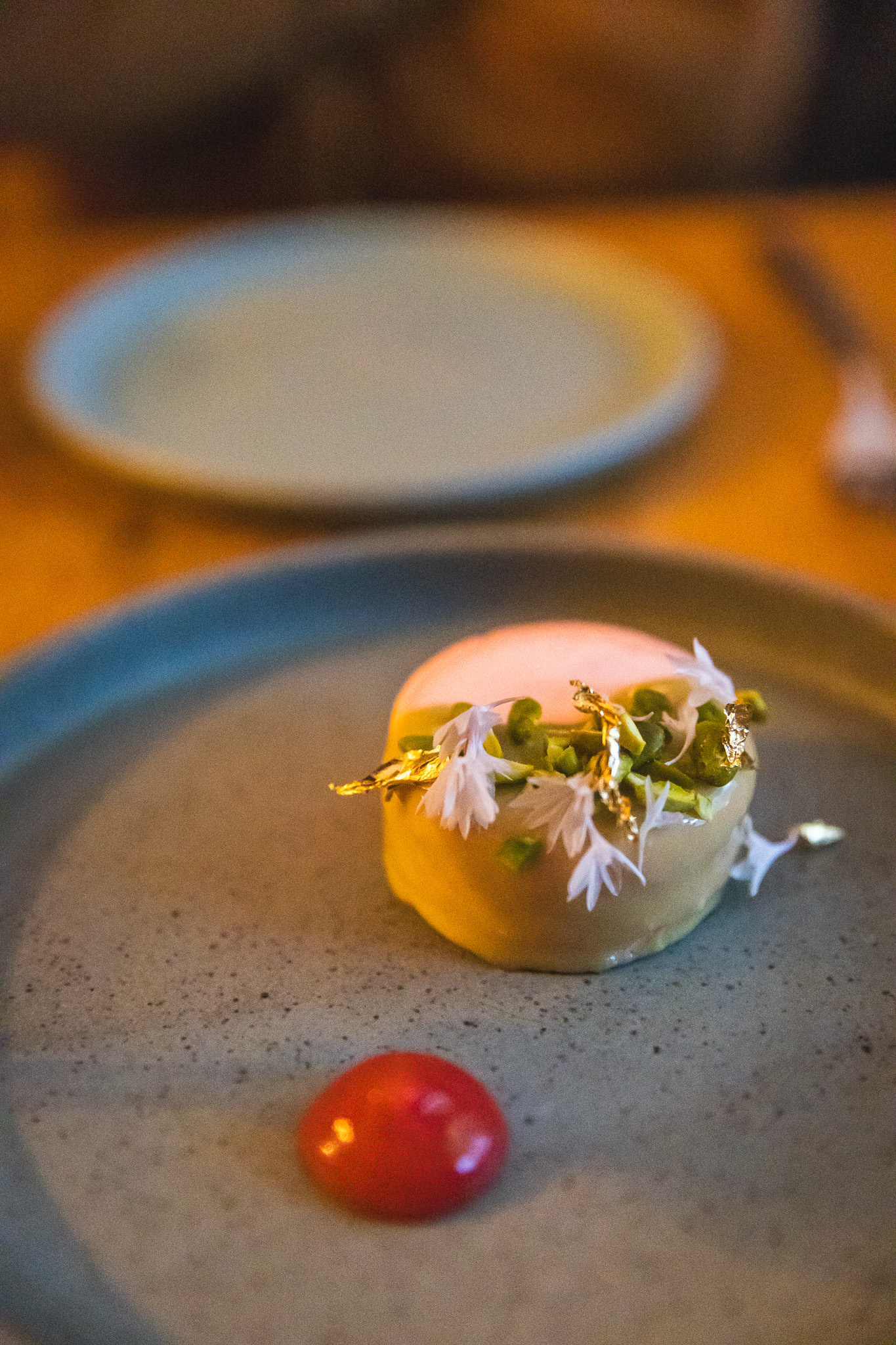 Pistachio dessert with a dollop of sauce