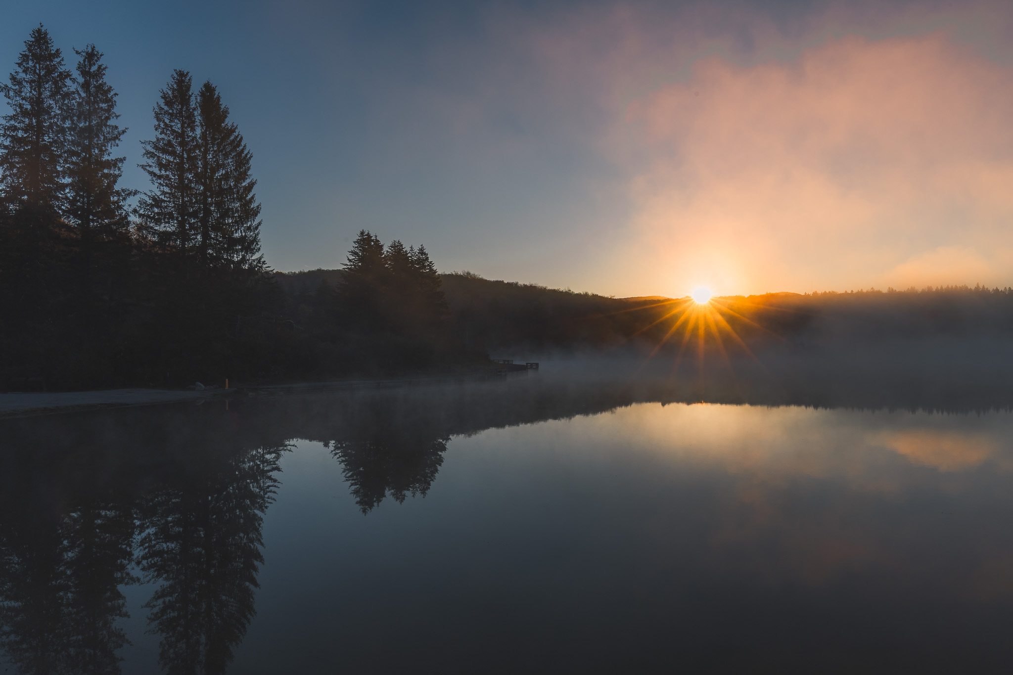 Sunrise on a foggy lake