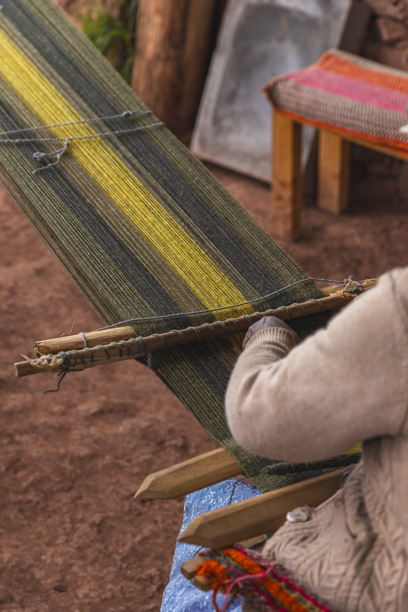 Juana operating the backstrap loom
